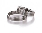 Chique trouwringen van palladium met witgoud van 4,5 mm breedte met 3 briljant geslepen diamanten van 0,039 ct.