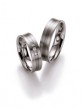 Strakke, palladium trouwringen van 5,5 mm breedte met 3 briljant geslepen diamanten van in totaal 0,09 ct.
